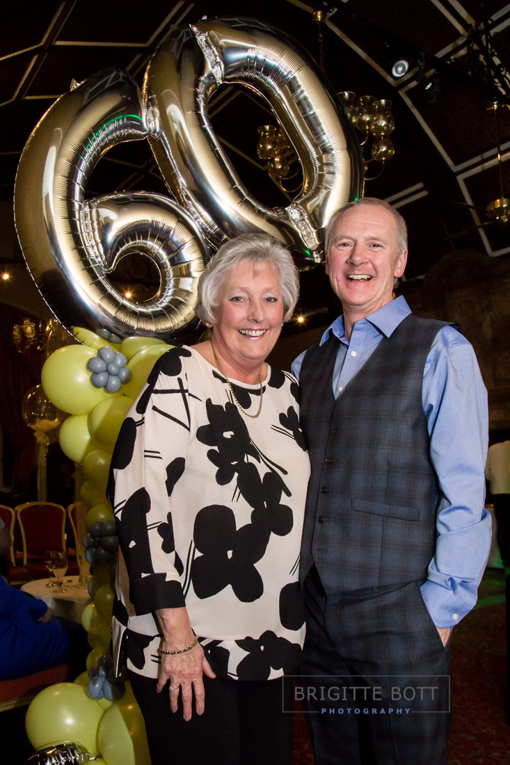 couple with balloons at a birthday celebration